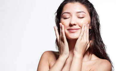 Woman happy to scrub cleanses the skin