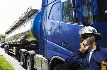 Wall Mural - fuel truck and driver, tanker truck delivering fuel and oil