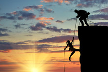 Silhouette Of Two Climbers