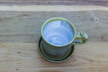 Empty tea cup on wooden table