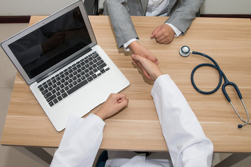 Wall Mural - Doctor and businessman shaking hands