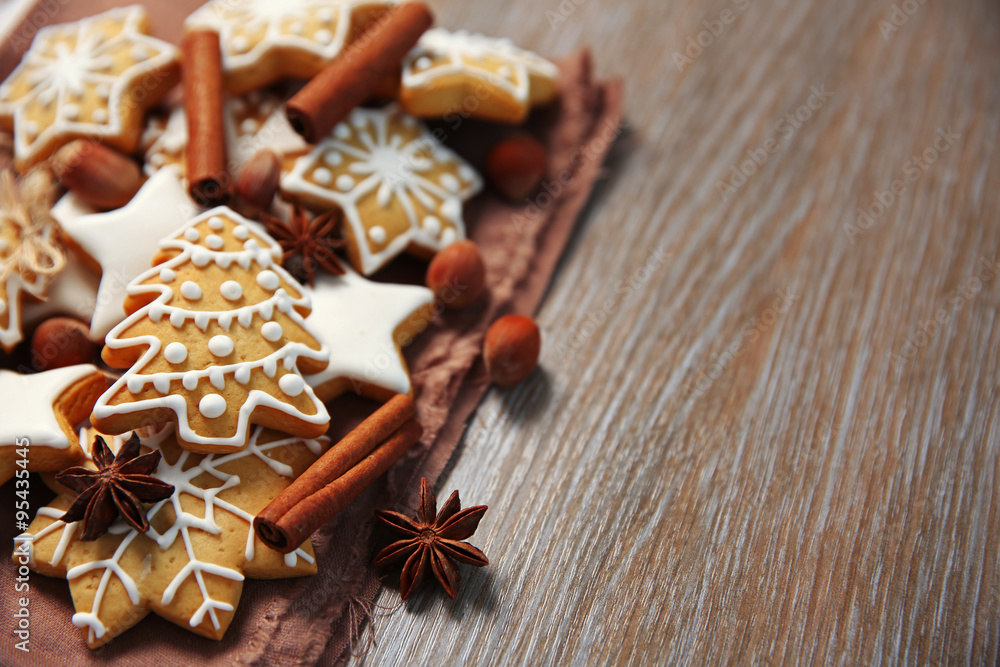Christmas cookies with spices on wooden table