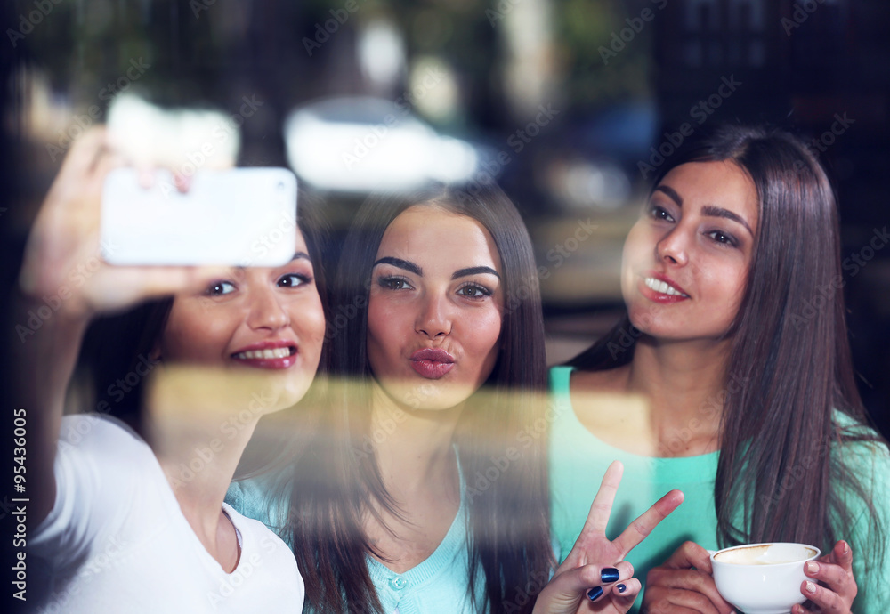 Best friends together takes selfie in the mirror