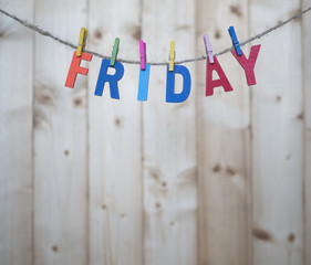 weekdays 6 - friday word by wooden letters hang with rope on wood background (weekdays word series)