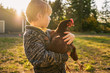© RooM The Agency - Boy holding a chicken