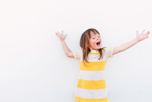 Smiling Girl With Outstretched Arms