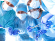 © lenetsnikolai - Team surgeon at work in operating room