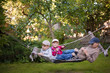 © izuboky - children playing fun together lying hammock, garden  yard