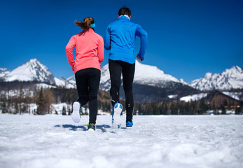 Wall Mural - Young couple jogging