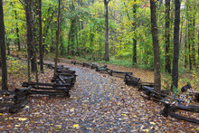 Hiking Trail In The Woods With Split Rail Fence On The Sides, Kings Mountain State Park