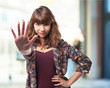 © asierromero - young woman doing stop sign