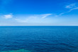 Blue sea waters and clear blue sky horizon