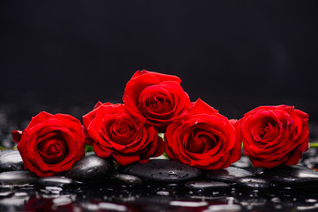 Still life with red rose with candle and therapy stones 