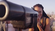 Two Black Woman Best Friends Looking Through Telescope On Pier