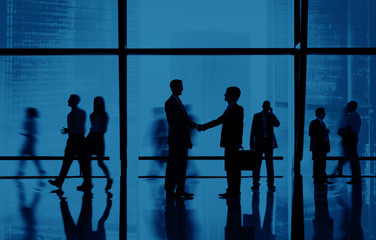 Wall Mural - Silhouette Group of Business People Handshake Concept