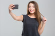 © Drobot Dean - Happy woman making selfie photo
