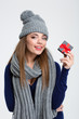 © Drobot Dean - Woman with scarf and hat holding jewelry gift box
