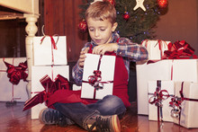 Lovely Little Boy Opens A Christmas Gifts