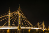 Fototapeta Miasto - Illuminated Albert bridge in west London at night
