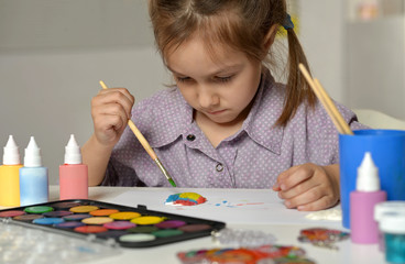 Wall Mural - little girl drawing at home