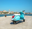 Blue vintage scooter on the waterfront