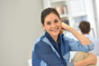 © goodluz - Portrait of young woman in office