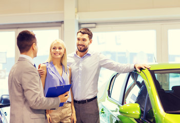 Poster - happy couple with car dealer in auto show or salon