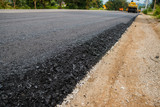 Fototapeta Desenie - Close-up asphalt at the road under construction.