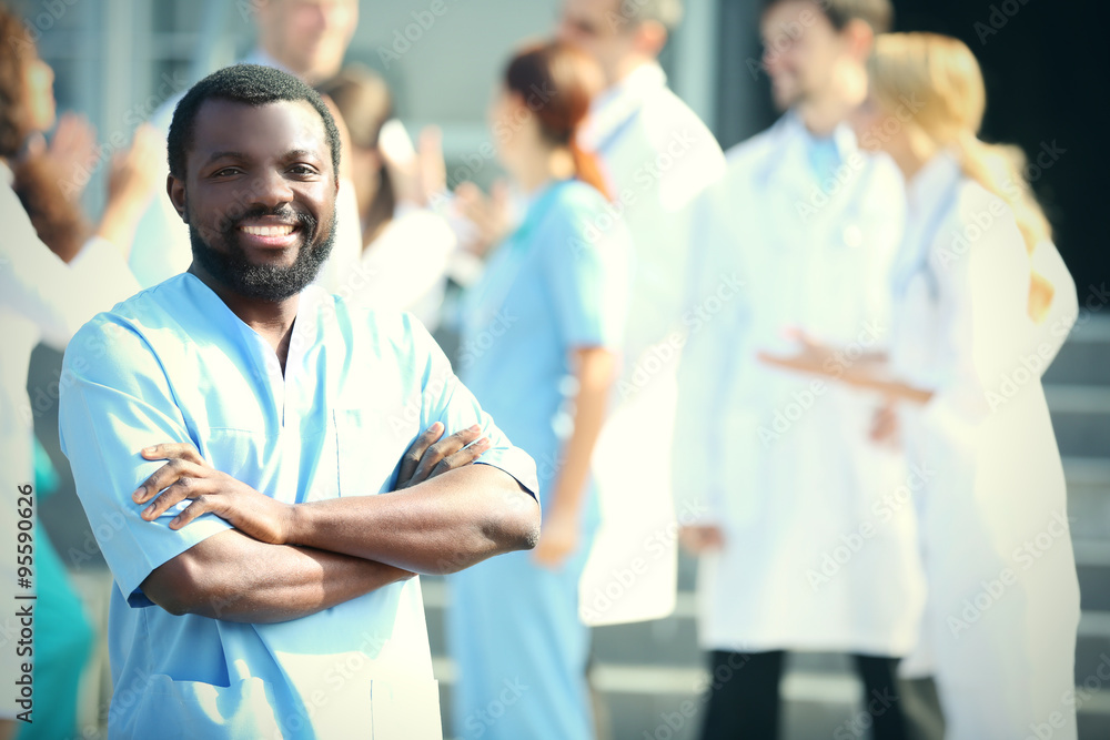 Portrait of an handsome smiling doctor