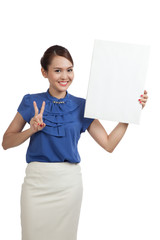 Young Asian woman show victory sign with blank sign