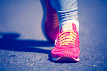 Wall Mural - athletic pair of feet on a grass