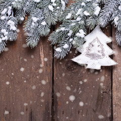 Spruce branches,  christmas decoration  on aged wooden  backgrou