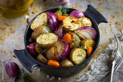 roasted potatoes with  onions, carrot and garlic Slika na platnu