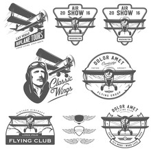 Set Of Vintage Biplane Emblems, Badges And Design Elements