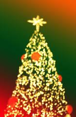 Multicolored defocused bokeh lights christmas tree background co