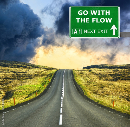 GO WITH THE FLOW road sign against clear blue sky Poster