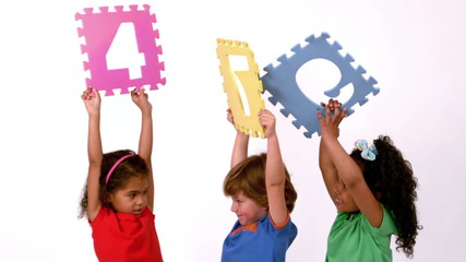 Wall Mural - School kids holding up coloured signs