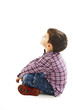 © Jelena Ivanovic - Portrait of a cute little boy sitting on the floor, looking up. Isolated on white background