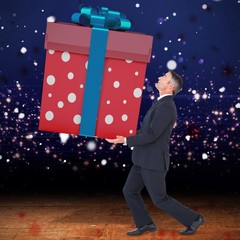 Canvas Print - Composite image of stylish man with giant gift