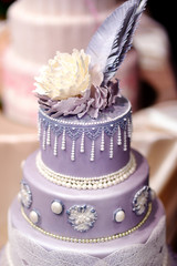 Wall Mural - Purple wedding cake decorated with flowers