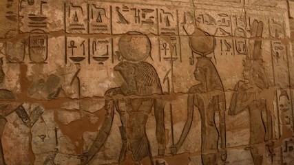 Poster - Ancient Egyptian hieroglyphic carvings on a temple wall at Medinat Habu in Luxor