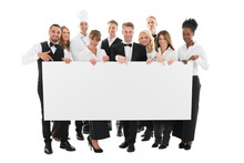 Confident Restaurant Staff Holding Blank Billboard