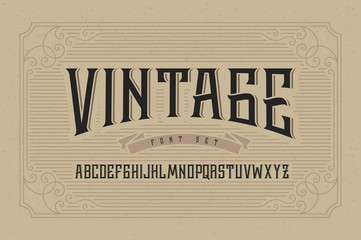 Wall Mural - Vintage font set on cardboard texture vector background with decorative ornate frame.