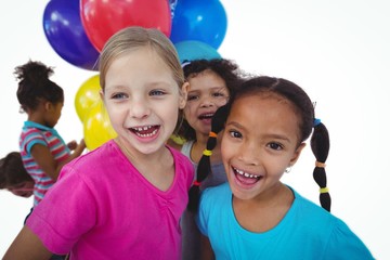 Wall Mural - Group of kids together with balloons