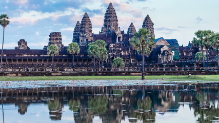 Fototapete - Timelapse of Cambodia landmark Angkor Wat with reflection in water. Panning camera