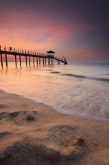 Wall Mural - Silhouette of fisherman cottage during sunrise