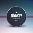 Hockey puck isolated on ice with blur 
