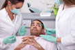 dentist curing a girls teeth