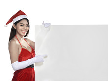 Pretty Asian Woman Wearing Santa Claus Costume Holding Blank Board