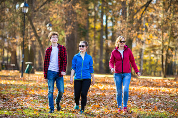 Wall Mural - People walking in city park